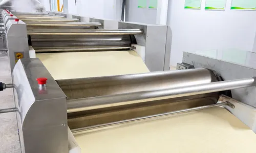Dough rolling process in instant noodle factory